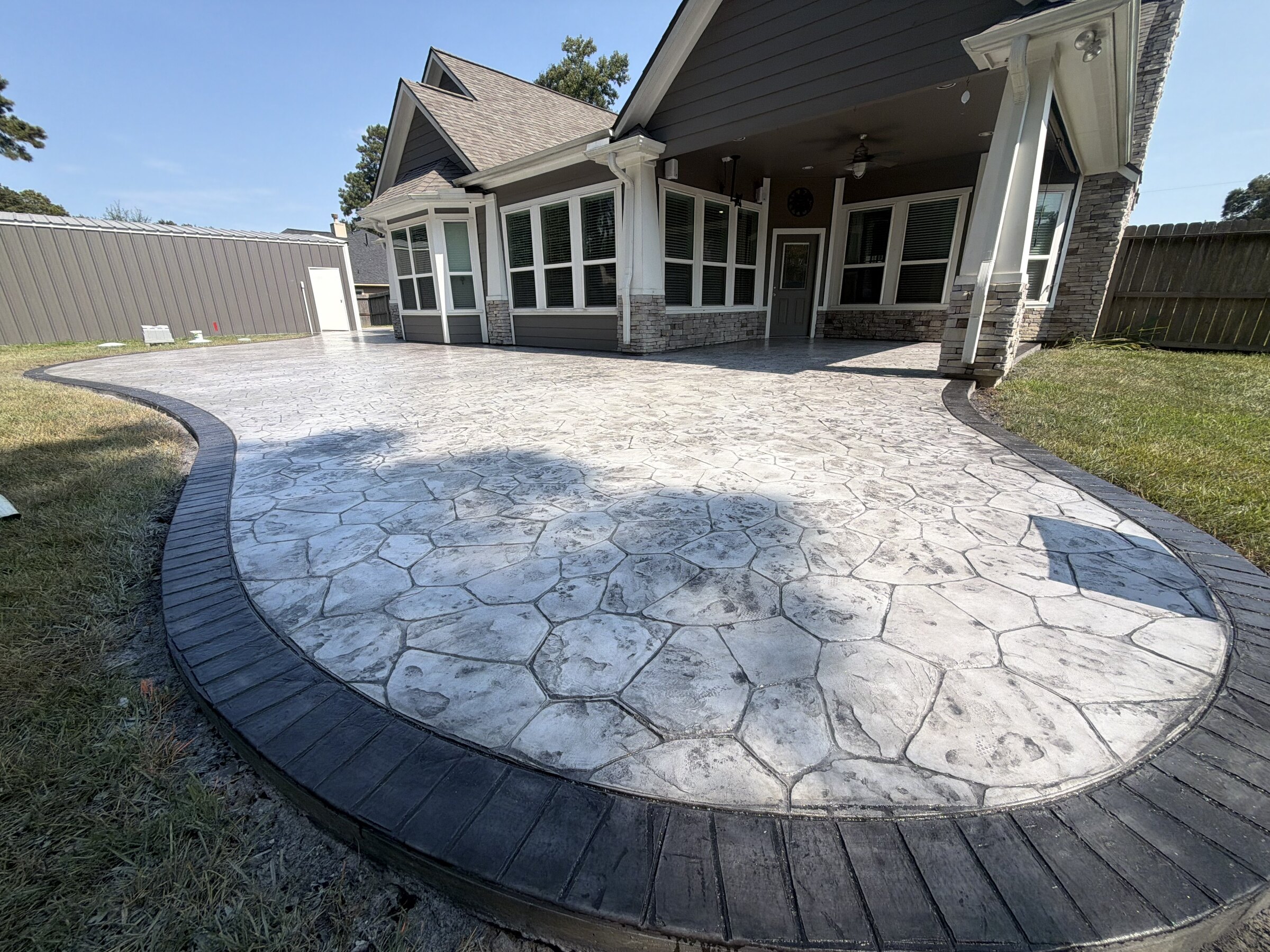 Finished stamped concrete patio completed by Urban Stone